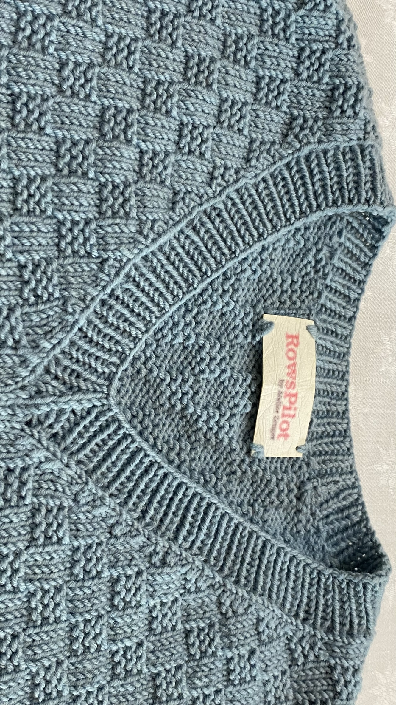 V-Abschluss in Runden gestrickt